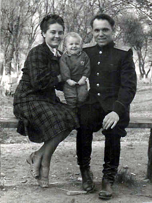 Young married couple with a smiling baby