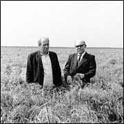 Two men, Konakov and Ovcharenko, in the field.